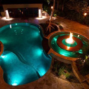 swimming pool lit up at night