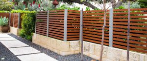 wood-look aluminium louvre fencing outside a Perth home
