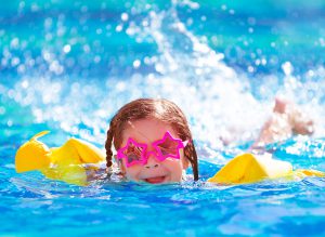 Girl swimming in a pool in Perth