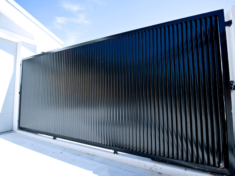 Black louvre fence and electric gates outside a Perth home