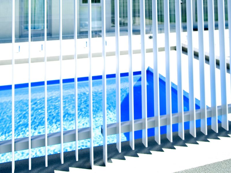 aluminum slat fence surrounding a pool in Perth 